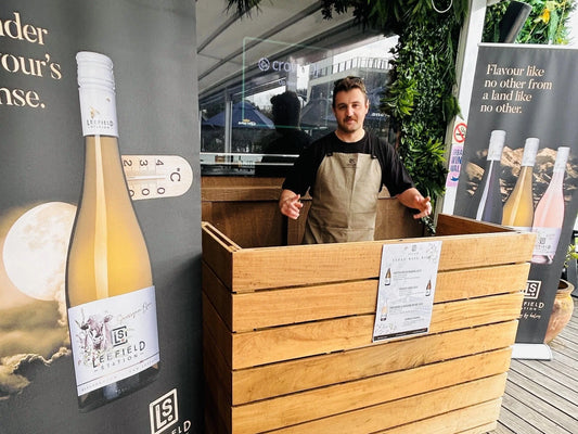A stylish setup showcasing top wines at the Metro Magazine Top 50 Wines Tasting Event.