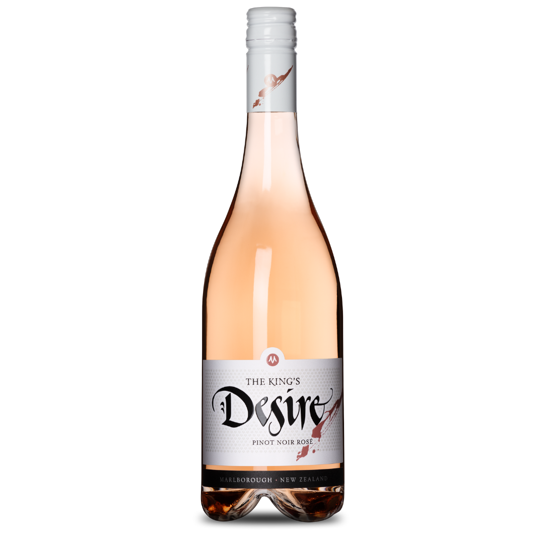 A 2022 bottle of The Kings Desire Pinot Noir Rosé from The King Series in Marlborough, New Zealand features a light pink hue, citrus notes, a white cap, and a label with elegant typography and a small crown design—truly regal.