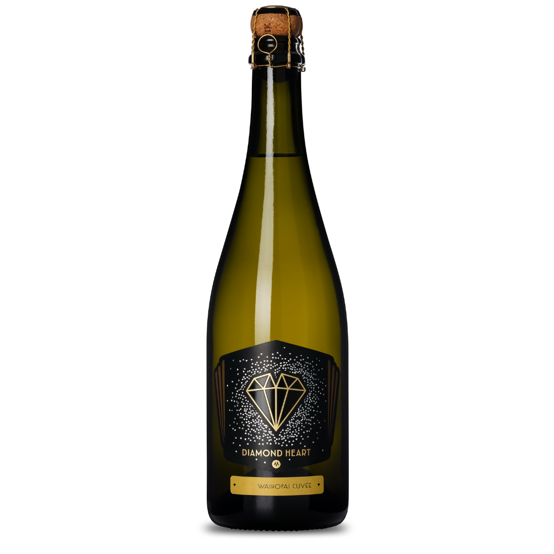 A bottle of the 2018 Diamond Heart Waihopai Cuvée, featuring a striking black label adorned with a diamond illustration and the graceful inscription of its name. It is completed with a cork top secured by a metal cage, making it ideal for celebrating special moments.