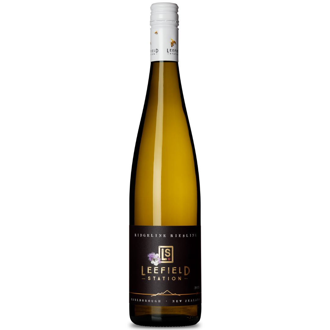 A clear glass bottle of Leefield Station Ridgeline Riesling 2023 is displayed against a white background. From Marlboroughs Waihopai Valley, it has a dark label with gold and white text and a grapevine illustration, topped with a white screw cap.
