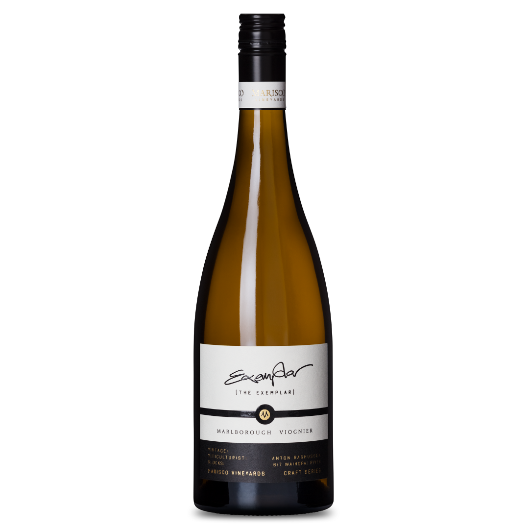 A bottle of The Craft Series THE EXEMPLAR VIOGNIER 2016 wine with a black screw cap, featuring a white and black label with gold accents that highlights the vineyard name and the wines vibrant aromas and orange citrus hints, set against a plain white background.