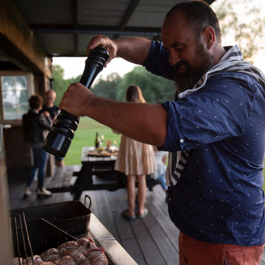 Anton Rasmussen, G.M of Viticulture at Marisco Vineyards, Marlborough, NZ. BBQ'ing at The Neds River Hut on the side of the Waihopai River.